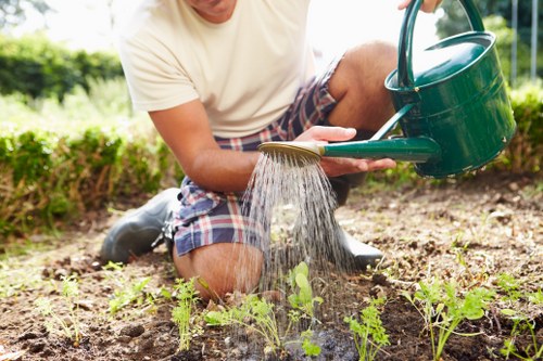 Professional gardeners working on a Surbiton garden in the first paragraph