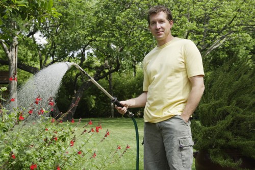 Insured garden professionals working carefully around plants and pathways